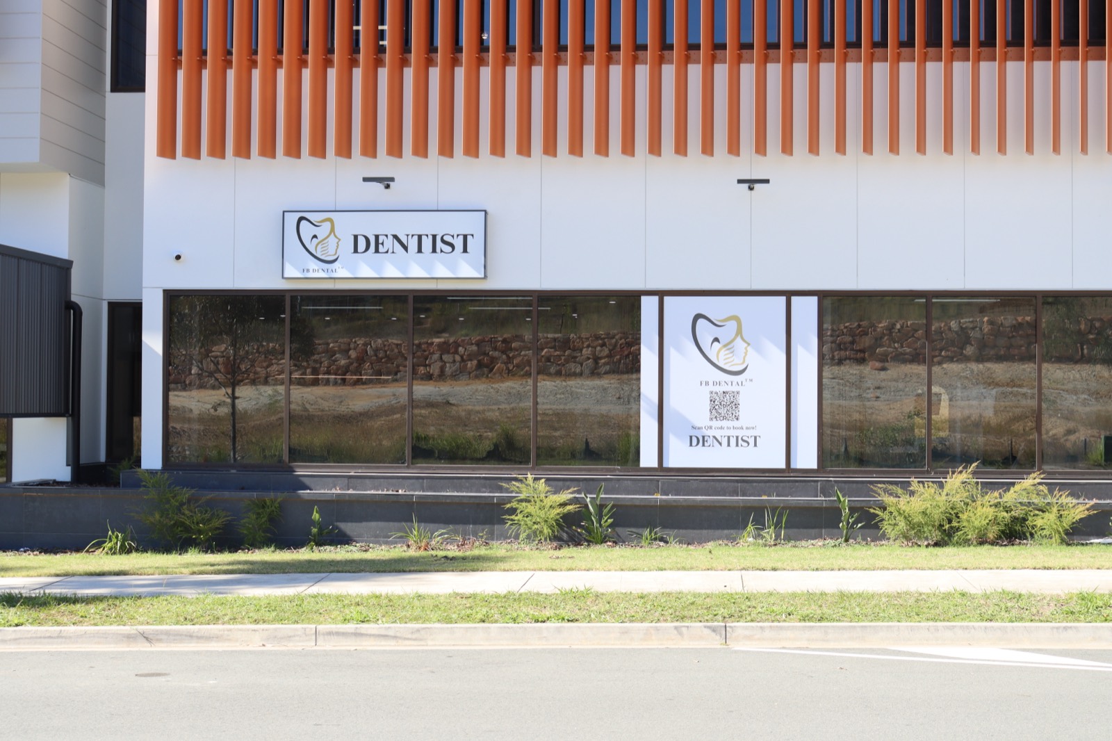 FB Dental entrance with DENTIST sign and FB Dental logo on the glass, Adler Circuit Yarrabilba